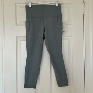 Athleta salutation stash pocket 7/8 tight blue/grey size M NEW WITH TAGS